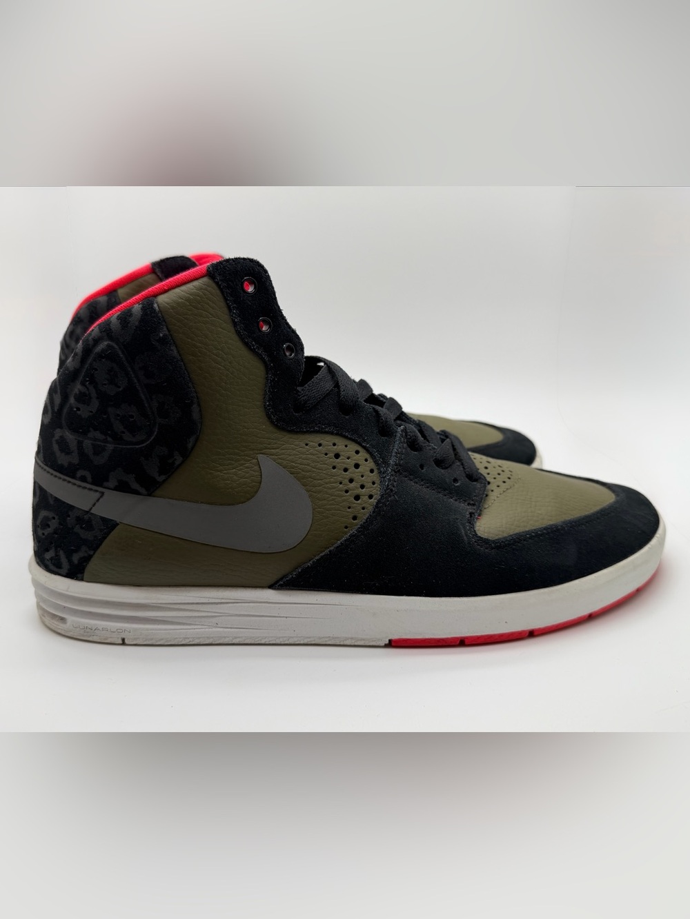 Nike SB Paul Rodriguez 7 High in the Black/Medium Olive/Laser Crimson colorway